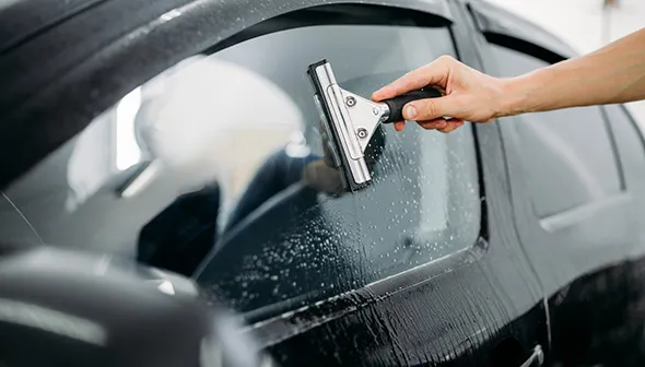 Key benefits of professional car window cleaning including safer driving, eco-friendly products, and affordable packages.